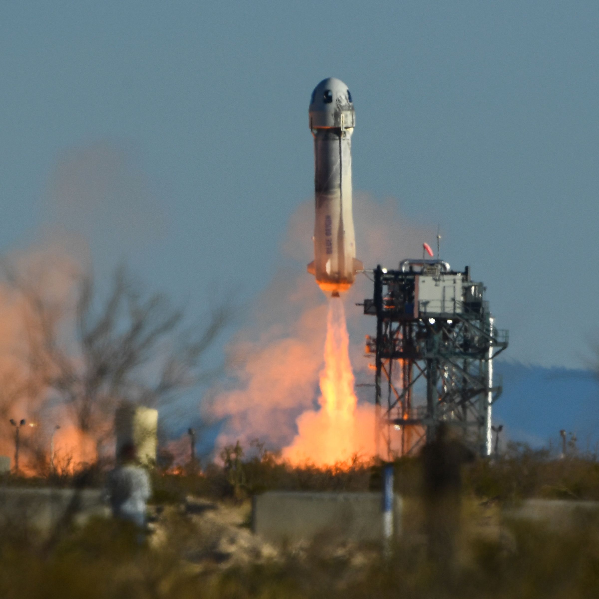A picture of the New Shepard rocket launching.