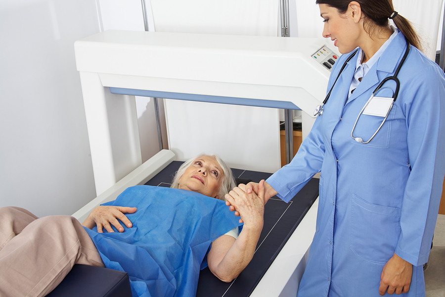 A doctor attending to a patientDescription automatically generated with medium confidence