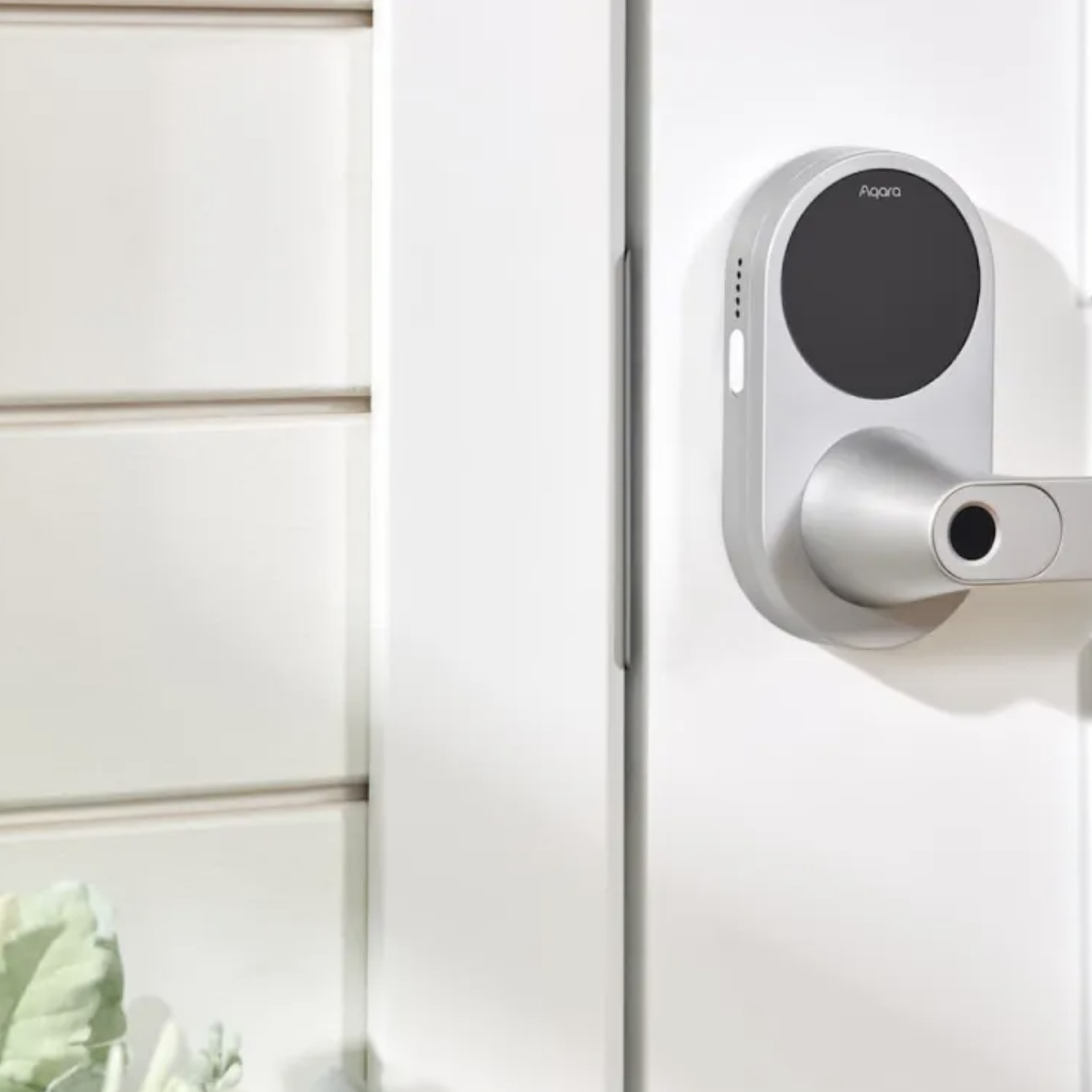 Aqara’s U300 smart lever lock installed on a white exterior door.