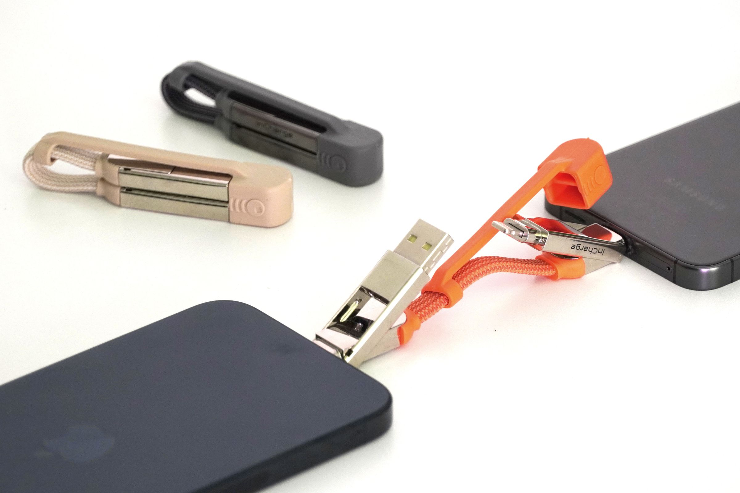 The Rolling Square inCharge XS charging cable connecting two smartphones together.