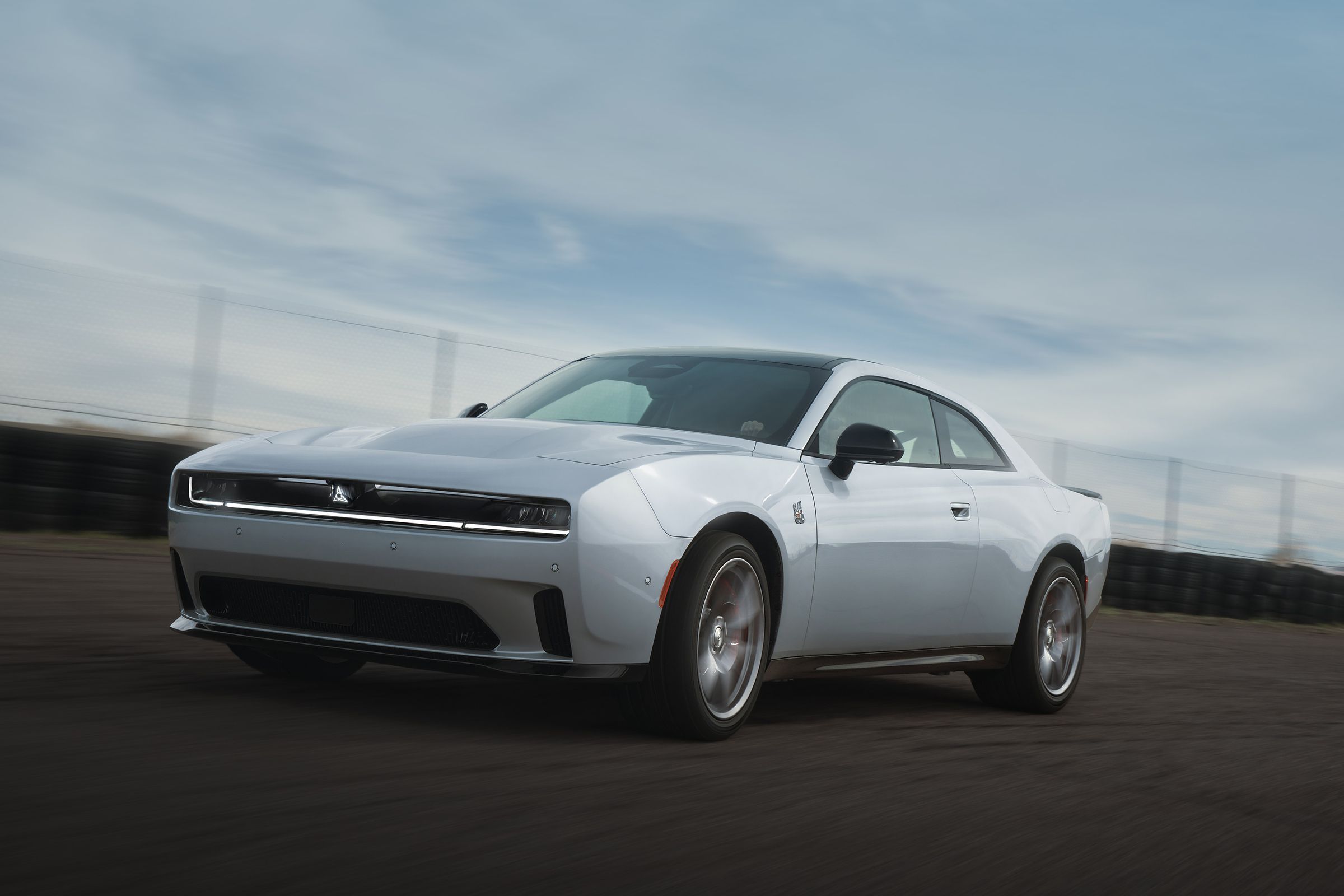silver two-door muscle car on a track