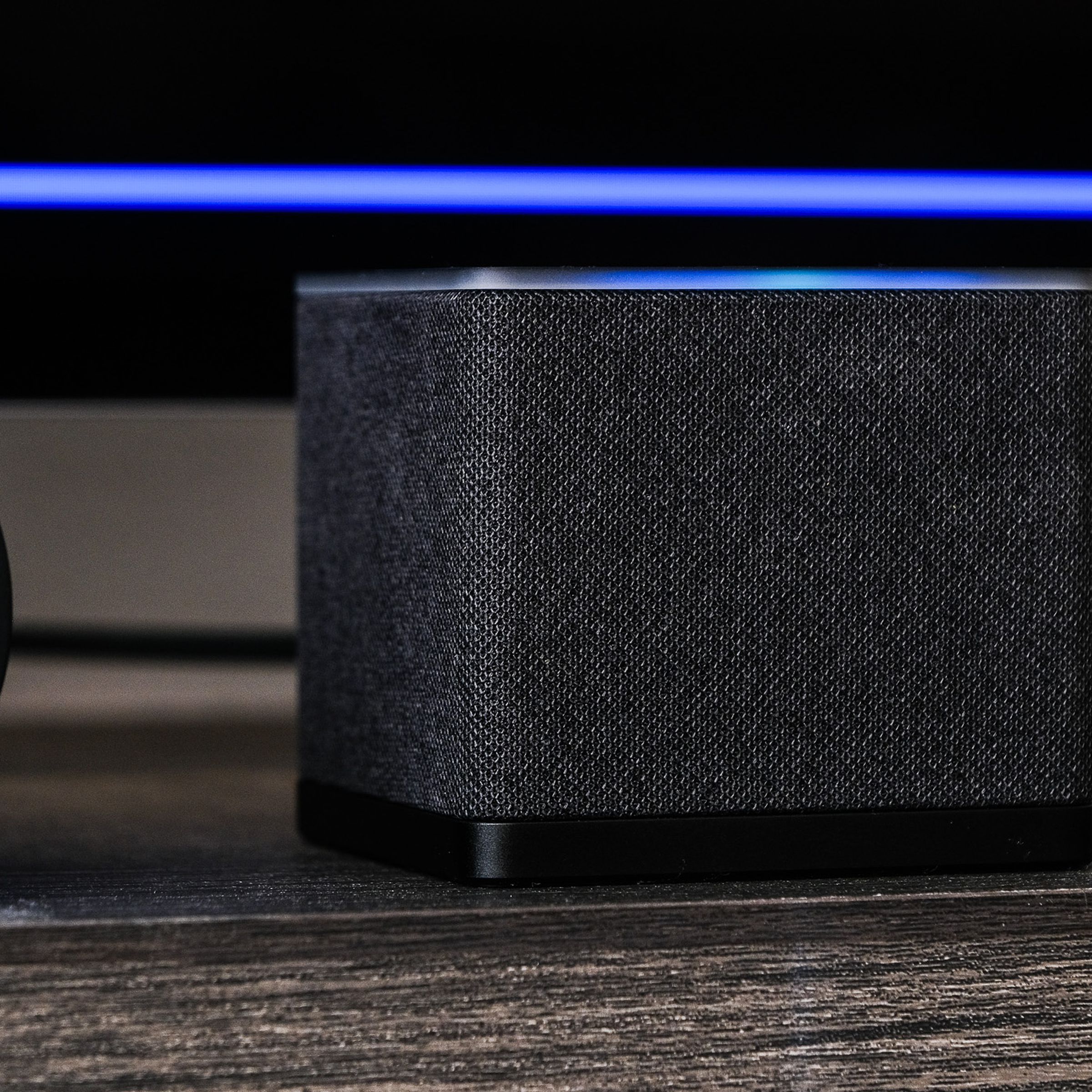 A photo of Amazon’s Fire TV Cube on a TV stand.