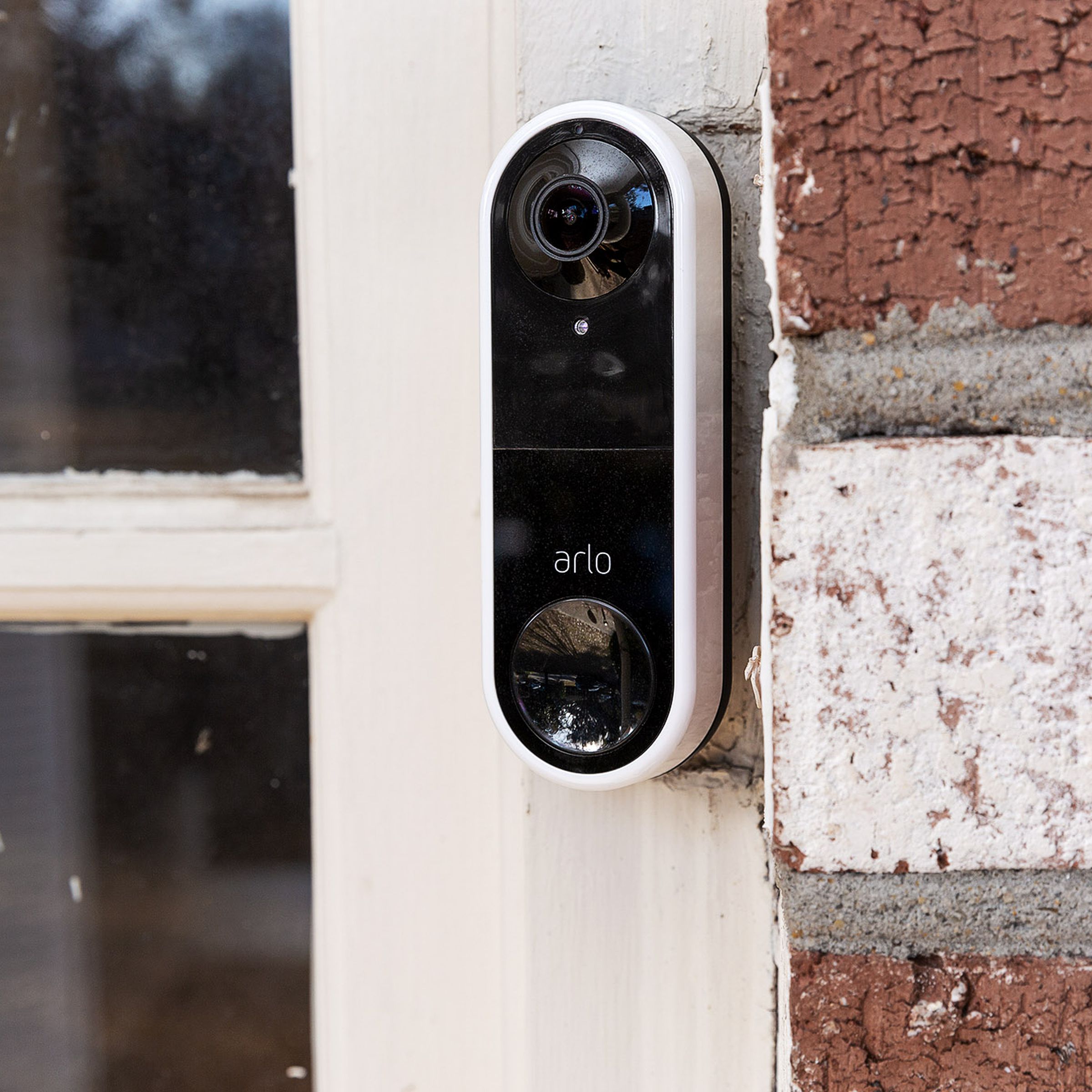 Arlo’s Essential wired video doorbell installed on a front door.