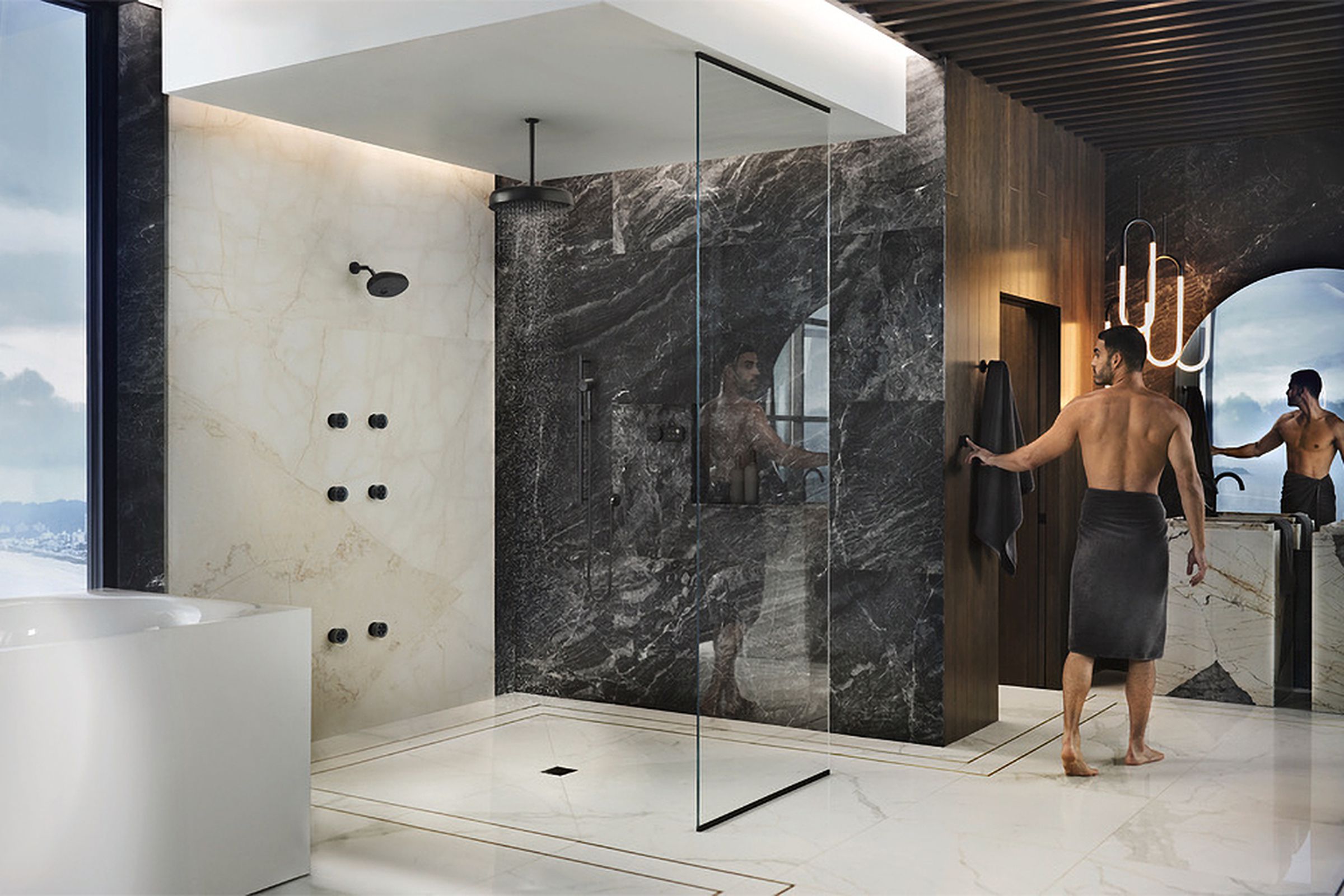A person uses a wall-mounted controller to active a Kohler Anthem smart show installation.